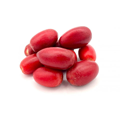 Freshly picked Miracle Berries from 4Roots Farm Campus, small bright red fruits known for transforming sour flavors into sweet tastes."