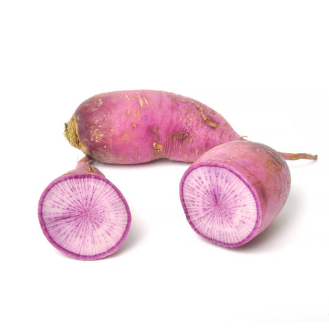 Vibrant slices of Purple Daikon Radish from 4Roots Farm Campus, showcasing their deep purple skin and white-to-purple marbled interior on a rustic cutting board.