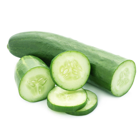 Freshly picked cucumbers from 4Roots Farm Campus, dewy and green, resting in a wooden crate with a natural farm backdrop.
