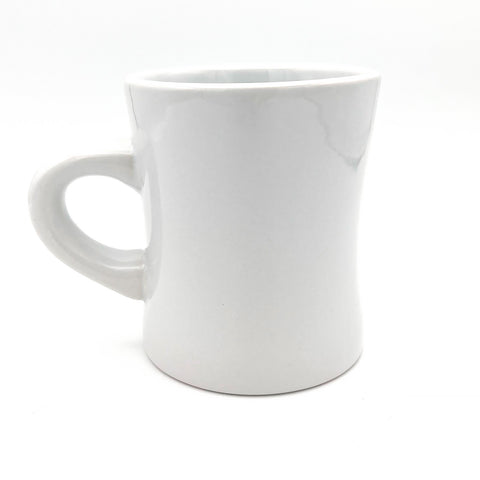Simple white coffee mug with a smooth, sturdy handle, perfect for a minimalist look.