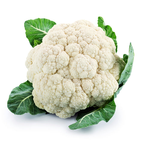 Fresh cauliflower head with tightly packed white florets and green leaves, harvested using organic practices