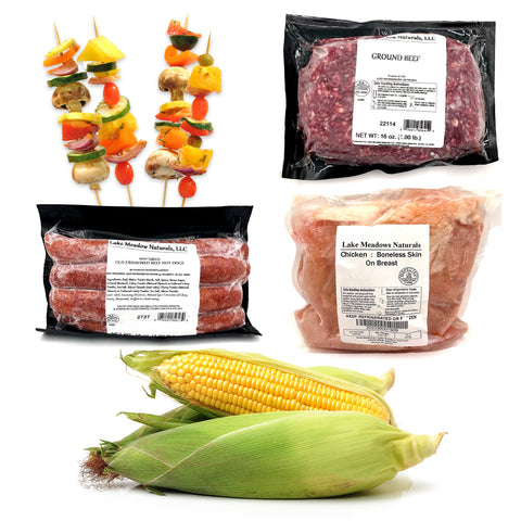 The Ultimate Grill Pack featuring local ground beef, hot dogs, chicken breasts, fresh corn on the cob, and organic vegetable skewers – perfect for grilling.