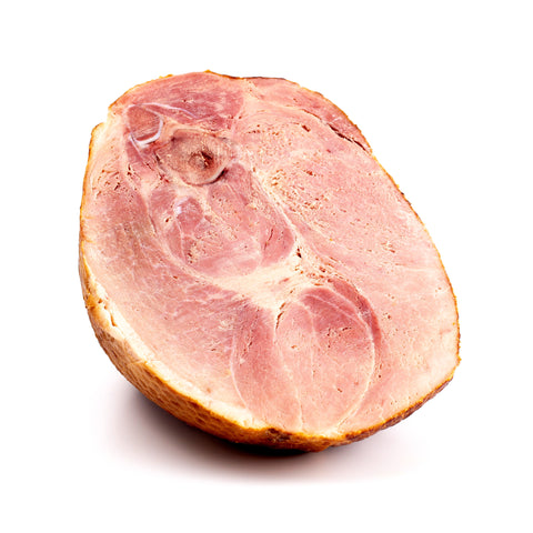 A nitrate-free half ham displayed on a plain white background, showcasing its natural golden-brown exterior and tender texture. The clean, simple presentation highlights the ham's quality and makes it the perfect choice for a wholesome, flavorful meal.