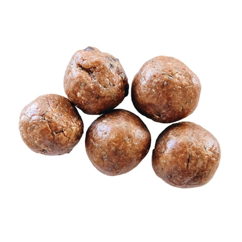 Chocolate Peanut Butter Bites from New Moon Market, made with natural, gluten-free ingredients like oats, peanut butter, cacao powder, and dried cranberries.