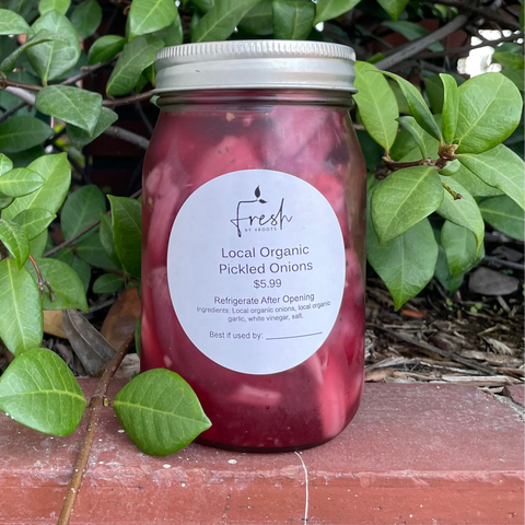 Jar of handcrafted pickled onions made with locally grown organic onions and garlic by Fresh by 4Roots.