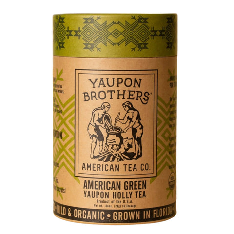 Image of a cylindrical package of American Green Yaupon Holly Tea on a white background. The eco-friendly tube contains 16 natural fiber sachets of certified organic, naturally caffeinated tea. The simple, clean packaging highlights its sustainable design and reflects the product's emphasis on natural ingredients and heritage.