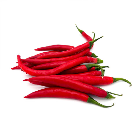 Side angle of Thai Peppers arranged neatly, capturing the full length and glossy appearance of the peppers.