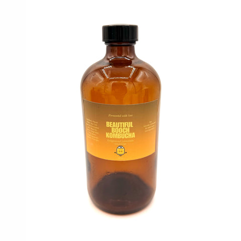 Bottle of Enlightened Lemonade Lemon Ginger Kombucha handcrafted in Orlando with fresh lemon and ginger.