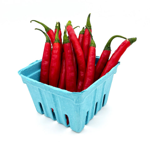 Close-up of Thai Peppers in a small blue crate, highlighting their rich red hue and shiny surface.