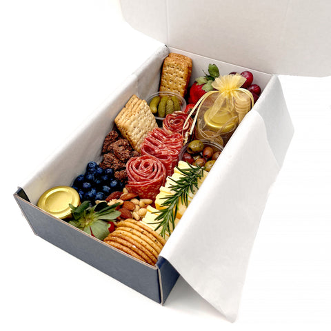 Handcrafted charcuterie box featuring gourmet meats, artisan cheeses, fresh fruits, crackers, nuts, and sweet accompaniments—perfect for gatherings, date nights, and gifts. Elevate your snacking experience with a beautifully curated selection of high-quality, locally sourced ingredients.