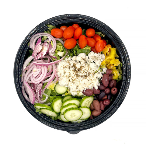 Farm-fresh Greek Salad with cucumbers, tomatoes, feta cheese, olives, and herbs from Fresh by 4Roots