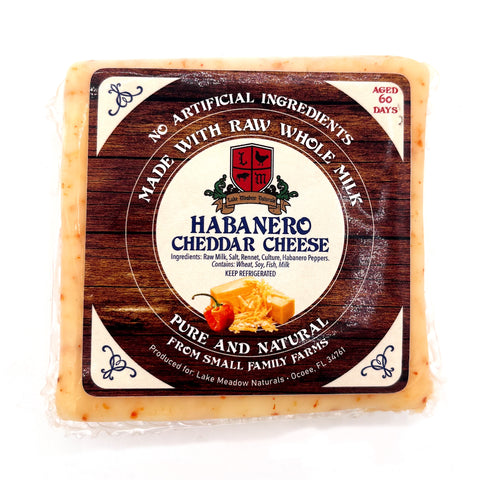 Block of Raw Milk Habanero Cheese from Lake Meadow Naturals, aged 60 days with spicy habanero peppers